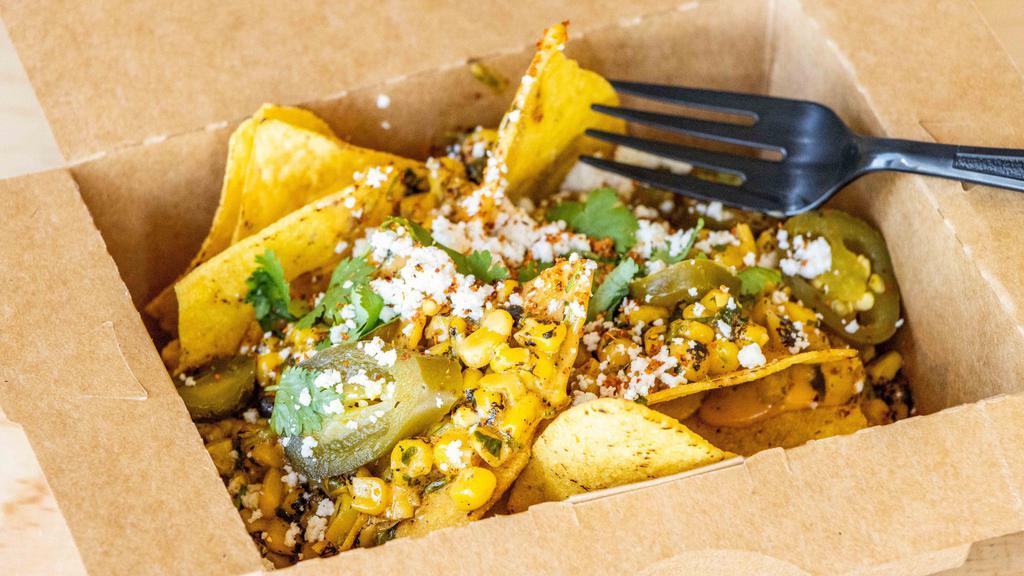 Mexican Street Corn Nacho~ · Crispy corn chips, shredded cheese, Mexican street corn, Jalapenos and cilantro.