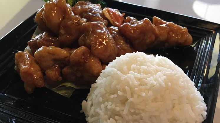 Orange Chicken · Deep fried breaded chicken in homemade orange sauce, it come with onions and peppers. A little spicy.