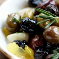 Herb Roasted Olives · Gluten-free. Vegetarian. Garlic, thyme, fennel and lemon peel.