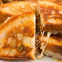 Gouda Grilled Cheese · Gouda Cheese is melted with Jack Cheese, roasted red peppers, and caramelized onion.