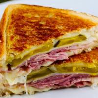Cuban Grilled Cheese · Smoked ham melted together with swiss cheese, dill pickles and our mayo sauce.