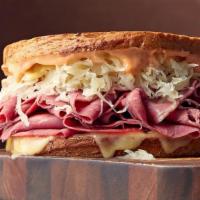 Reuben Grilled Cheese · Corned beef, sauerkraut, and Russian dressing are melted together with swiss cheese.