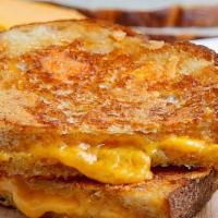 Cheddar Grilled Cheese  · Cheddar Cheese  grilled on Photota Bread.