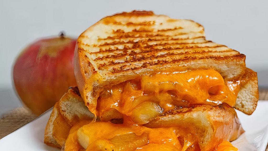 Chipotle Turkey Grilled Cheese · Chicken is melted with Cheddar cheese,  caramelized onion and Chipotle Mayo.