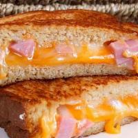 Chipotle Ham Grilled Cheese · Ham is melted with Cheddar Cheese, caramelized onion, and chipotle mayo.