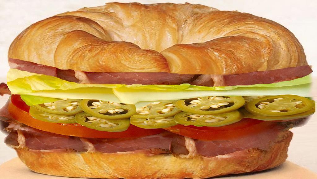Belly Buster Croissant · Double pastrami, swiss cheese, greek pepper, tomato ,lettuce, mayo & mustard.
