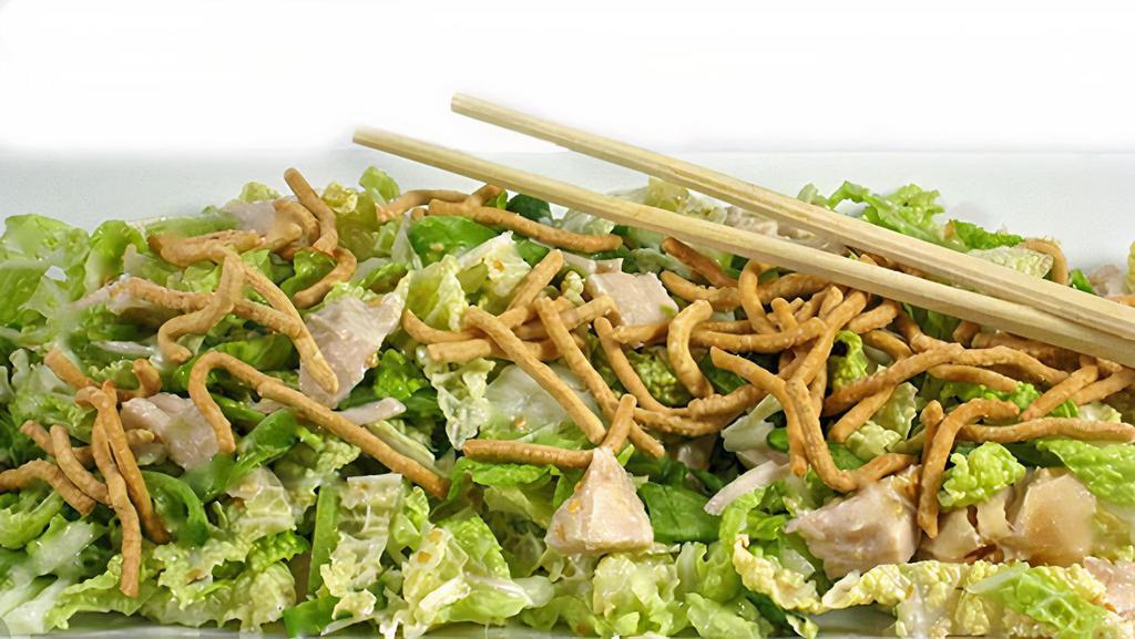 Asian Chicken · Mixed green lettuce, grilled chicken breast, shredded cabbage, with Asian sesame dressing.