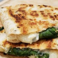Spinach Feta · Feel healthy while enjoying this green quesadilla. Includes feta cheese, baby spinach, slice...