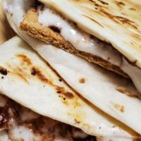 S'More Por Favor · Chocolate hazelnut spread, gooey marshmallow and cinnamon graham crackers on a toasty tortil...