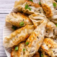Chicken Dumplings-Gyoza (5 Pcs) · Gyoza-style dumplings stuffed with minced chicken, garlic ginger and scallions. Pan fried un...