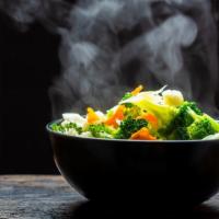 Side Of Steamed Vegetables · Fresh seasonal vegetables including broccoli and carrots steamed until tender.