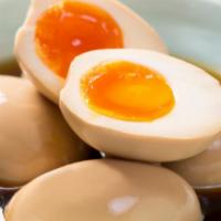 Soft Boiled Egg · Seasoned, soft boiled egg with a creamy yolk. A must with ramen!
