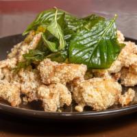 Popcorn Chicken · Deep-fried marinade chicken and basil leaf with sprinkling seasoning on top.