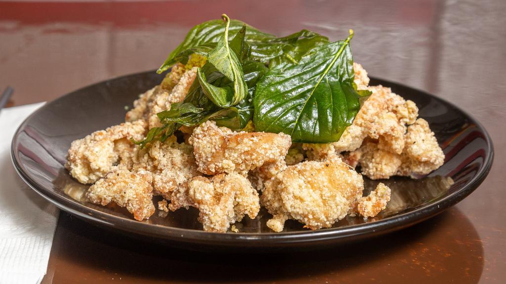 Popcorn Chicken · Deep-fried marinade chicken and basil leaf with sprinkling seasoning on top.