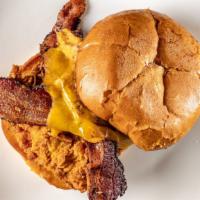 Bacon Cheddar Smushburger · Two Smushburger patties (beef, bacon Cheddar and onion patty) with two strips of thick-cut b...