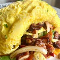 Meat Lovers Omelet · Smoked bacon, ham, sausage and caramelized onions folded in fresh eggs and accompanied with ...