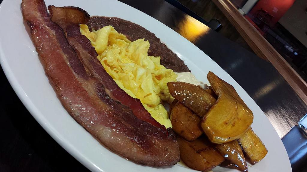 Sweet Plantain · Gluten free, vegetarian. Organic. Caramelized plantains, frijoles liquados , 2 eggs and Salvadoran cream. add bacon or sausage for $3.