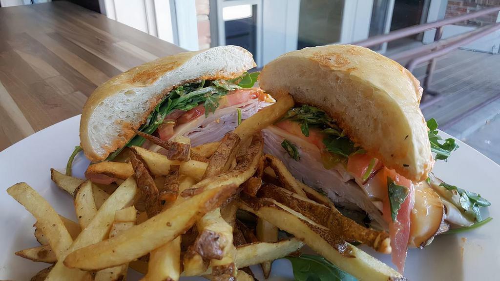 Turkey Or Chicken Panini · Smoked turkey or grilled chicken, roasted red pepper pesto smoked Gouda cheese, baby spinach, tomato and avocado in a all natural ciabatta.