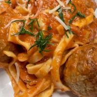 Fettuccine & Meatballs · Granny's meatballs with our herby tomato sauce and fresh Parmesan.