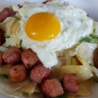 Carbonara · Crispy pancetta, sweet caramelized onions, garlic and fresh parmesan topped with an over eas...
