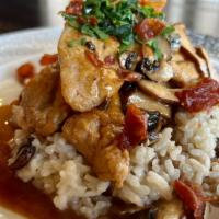 Chicken Marsala · Pan seared chicken breast served over our mushrooms risotto and a marsala wine reduction top...