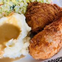 Salvadorian Spiced Fried Chicken  · Served with our home made garlic mashed potatoes n gravy and a slaw.