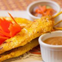 Chicken Satay · Strips of grilled, marinated chicken breast, served with peanut sauce and cucumber sauce.