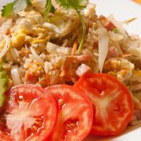 Chicken Fried Rice · Fried jasmine rice with meat, eggs, tomatoes, white and green onions served with fresh cucum...