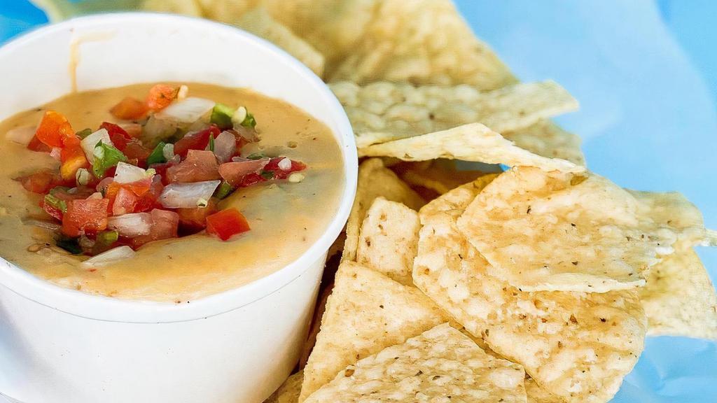 Chips + Queso · White Corn Chips + Spicy Queso Blanco