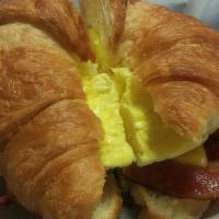 Breakfast Sandwich · Eggs, American cheese and choice of ham, bacon or sausage. Choice of croissant, bagel, or sl...