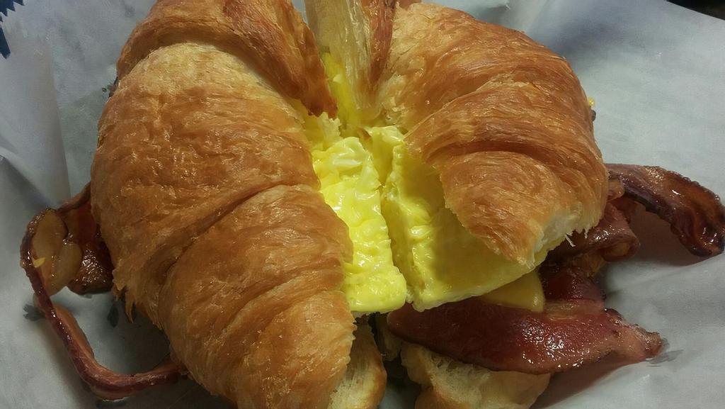 Breakfast Sandwich · Eggs, American cheese and choice of ham, bacon or sausage. Choice of croissant, bagel, or sliced bread.