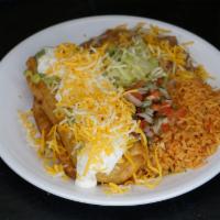 Chimichanga Combo · guacamole, sour cream, cheese. Served with rice and beans.
