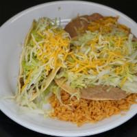 Tostada And Beef Taco Plate · Served with rice and beans.