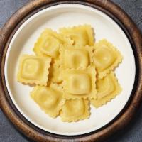 Custom Ravioli · Fresh cheese ravioli cooked with your choice sauce, protein, and toppings.