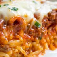And I Love Lasagna · Layers of pasta, sauce, and cheese topped with fresh pecorino romano and baked to perfection.