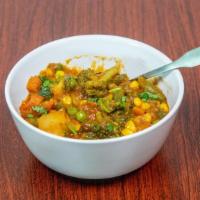 Vegetable Curry · Dairy free. Gluten free. Mixed vegetable, ginger, garlic, curry sauce.