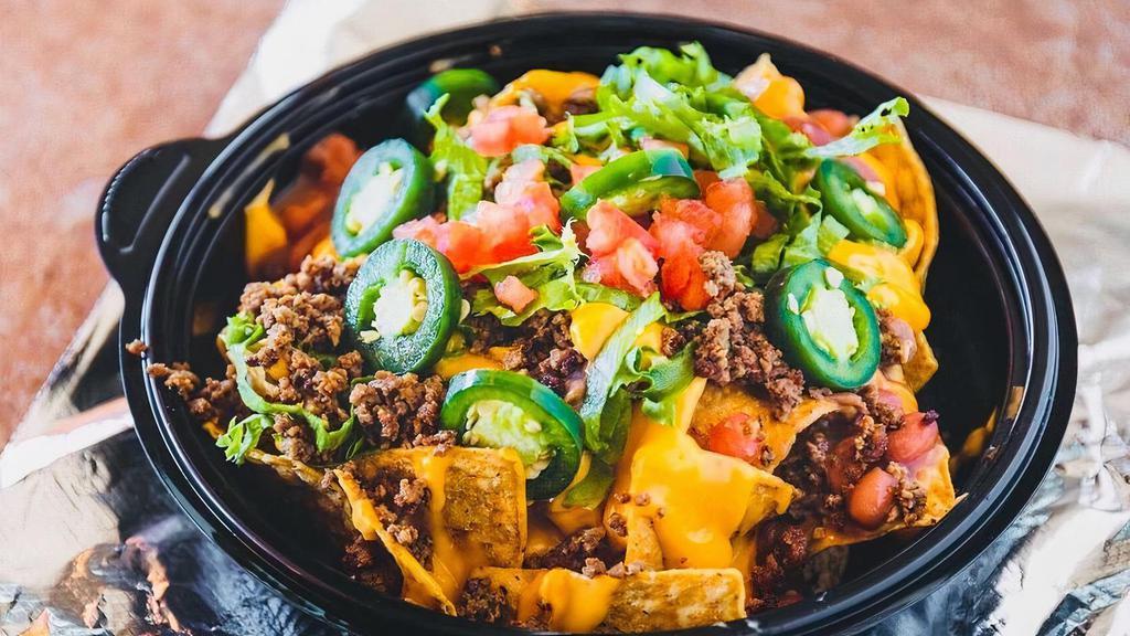 Small Nachos  · Chips, ground beef, beans, jalapeños, lettuce, tomato, and nacho cheese.
