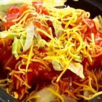 Tamale Bowl · Tamale, beans, potatoes, cheese, lettuce, tomato, and red chile.