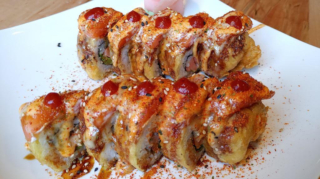 Heaven On Earth Roll · Smoked Salmon, Cream Cheese, Jalapeno, Avocado inside, deep fried, Fresh Salmon on top with Sesame Seeds and 4 kinds of sauces