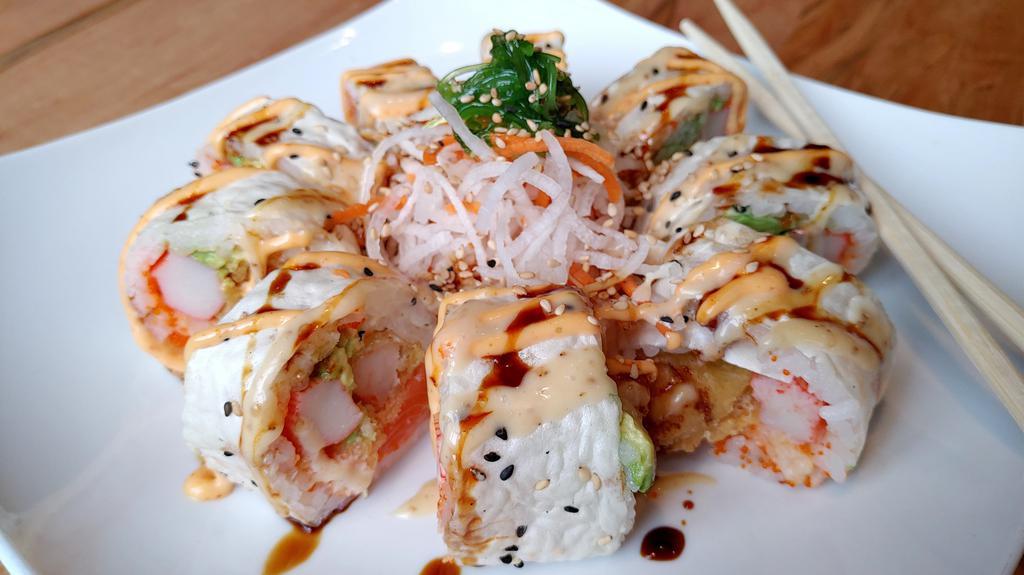 Monster Roll · Salmon, crab, avocado, cucumber, crawfish lobster, shrimp tempura, flying fish eggs inside and special sauce on top.