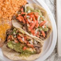 Two Carne Asada · Two steak soft tacos with guacamole and mexican salsa