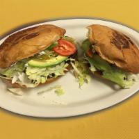 Torta · Choice of meat. Includes mayo, lettuce, tomato, avocado, jalapeno and Mexican cream.