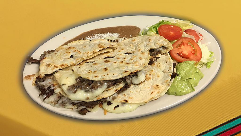Mulitas Plate (3) · Choice of meat (3), served with rice, beans, salad, guacamole, grilled jalapeno peppers, grilled onions.