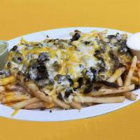 Carne Asada Fries · French Fries Covered with carne asada meat and melted cheese, Sides of guacamole and sour cr...