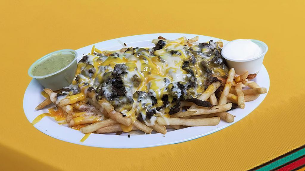 Carne Asada Fries · French Fries Covered with carne asada meat and melted cheese, Sides of guacamole and sour cream
