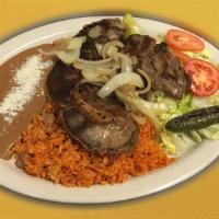 Carne Asada · Broiled skirt steak. Served with rice, beans, salad, guacamole, grilled jalapeno peppers, gr...