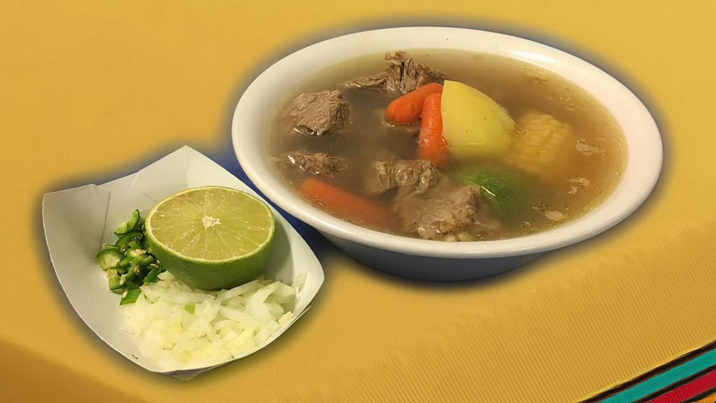 Caldo De Res · Mexican style beef soup, serverd with a side of onions, green chile and limes. Option of corn or flour tortillas.
