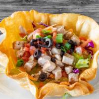 Caramba Chicken Salad* · Large, crispy tortilla bowl filled with iceberg lettuce, red cabbage, carrots, cheese, tomat...