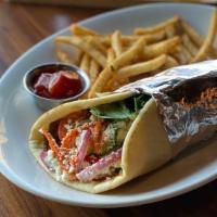Döner Kebab · Our Chef’s take on this traditional German street food,
warm Naan bread wrapped around thinl...