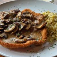 Chicken Jager Schnitzel · Breaded chicken and cremini mushrooms topped with a creamy paprika sauce and served with spä...